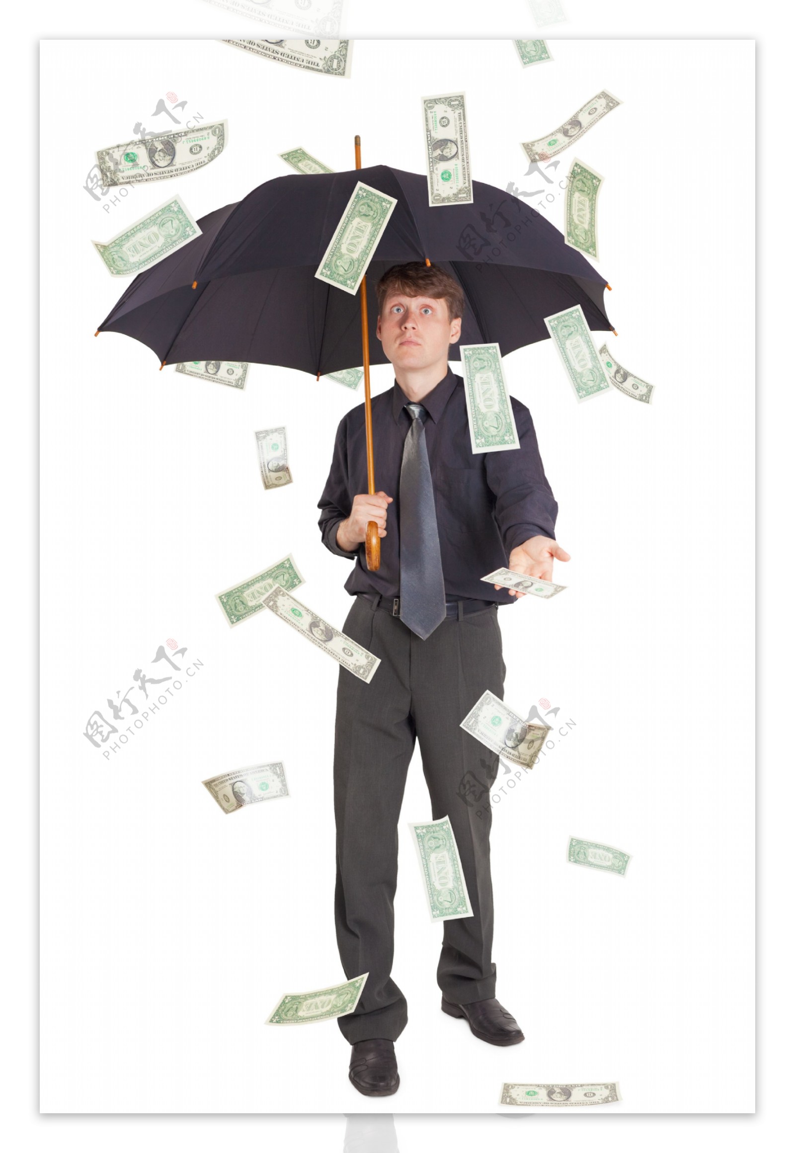 用伞挡住美元的商务男人图片